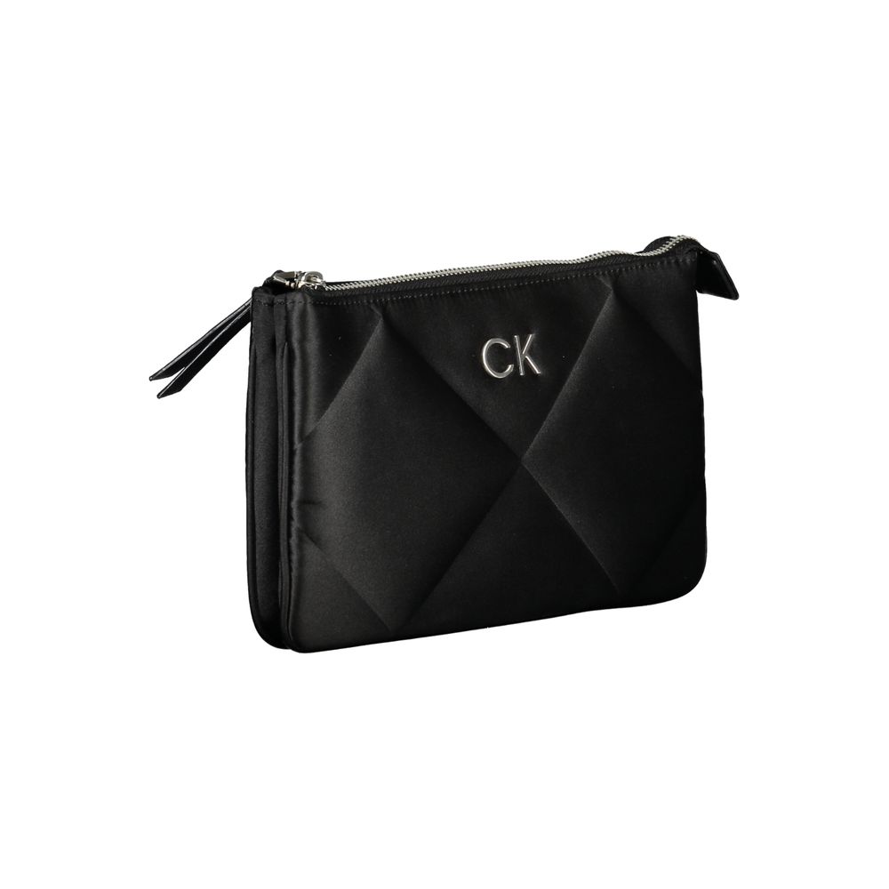 Calvin Klein Black Polyester Handbag with zip closure and logo, featuring adjustable shoulder strap and internal card pocket.