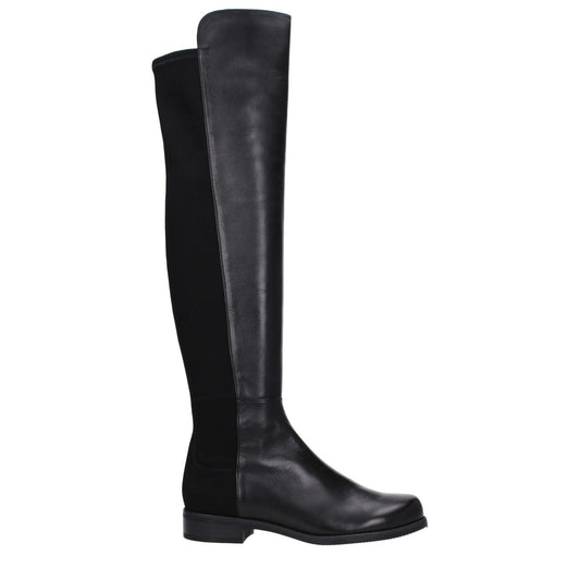Stuart Weitzman Black Leather Over The Knee boots with vintage effect and low flat heel, featuring round toe and rubber sole.