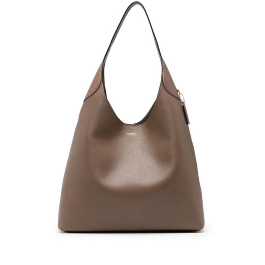 Elegant Coach Brooklyn leather hobo bag in light brown calf leather with logo details, single strap, and spacious main compartment.
