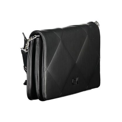 Calvin Klein Black Cotton Handbag with adjustable strap, two compartments, logo, snap closure, and contrasting details.