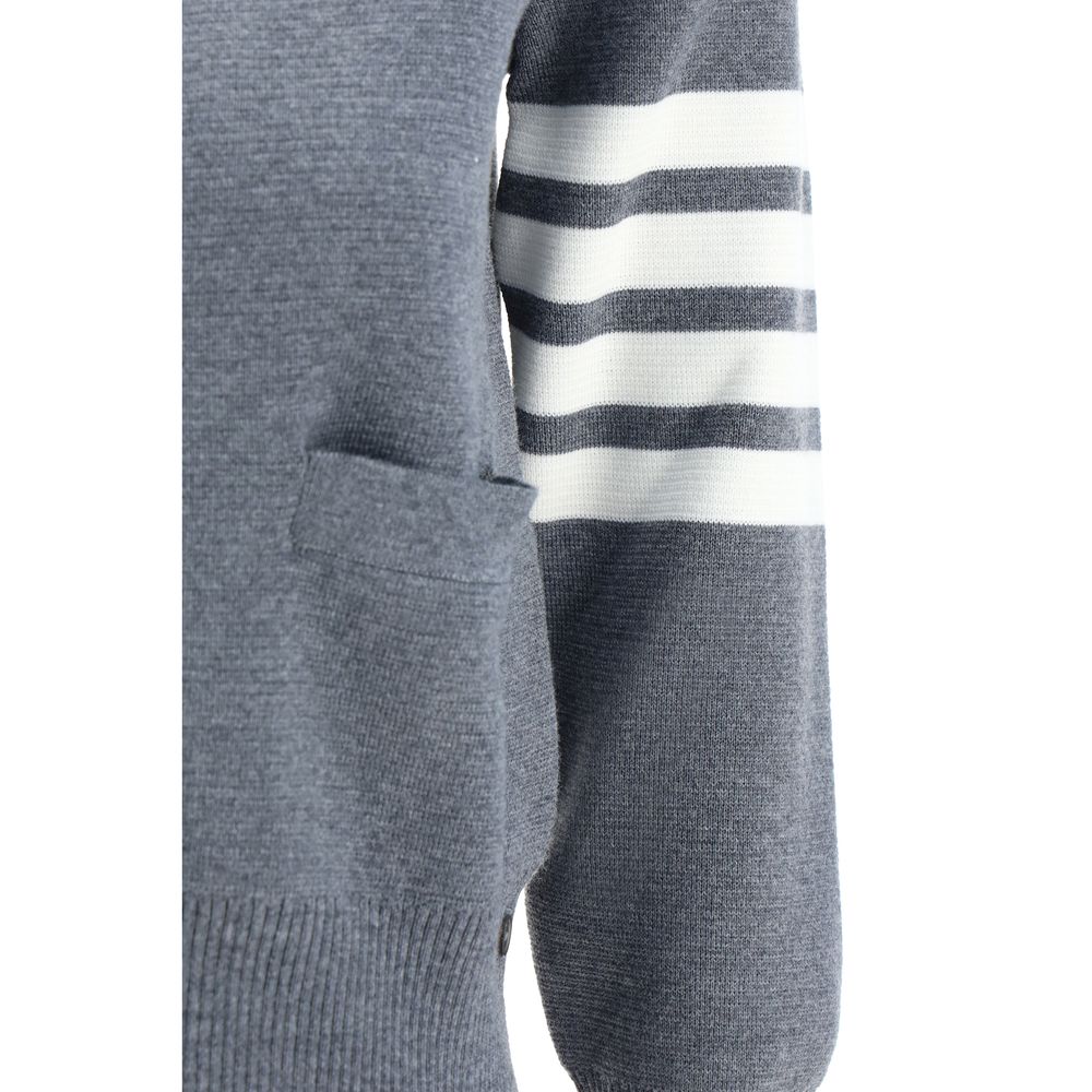 Thom Browne Gray Fleece Wool Cardigan with iconic striped band on sleeve, open front pocket, and ribbed cuffs, AW25 collection.