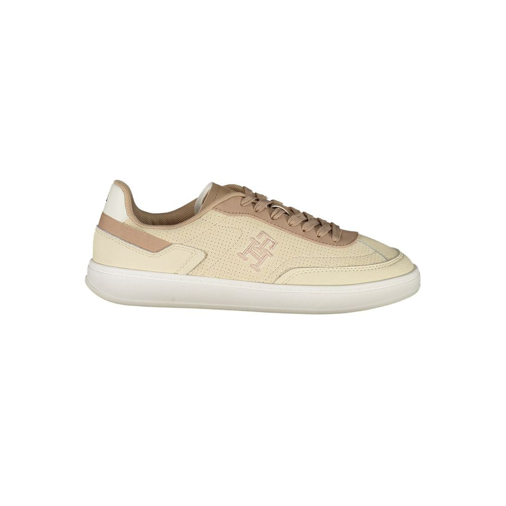Tommy Hilfiger Beige Leather Women Sneaker with chic contrast details and iconic embroidery, featuring a removable footbed for personalized comfort.