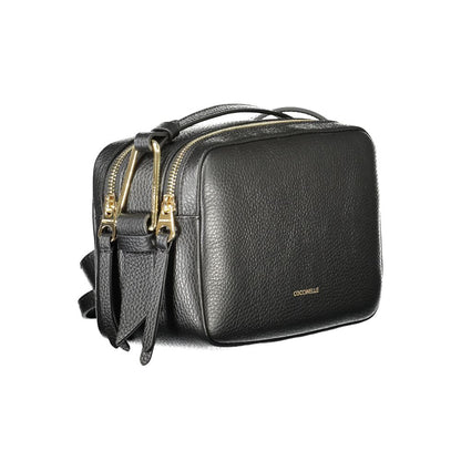 Coccinelle Black Leather Handbag with adjustable shoulder strap, two compartments, and zip closure, featuring logo on front.