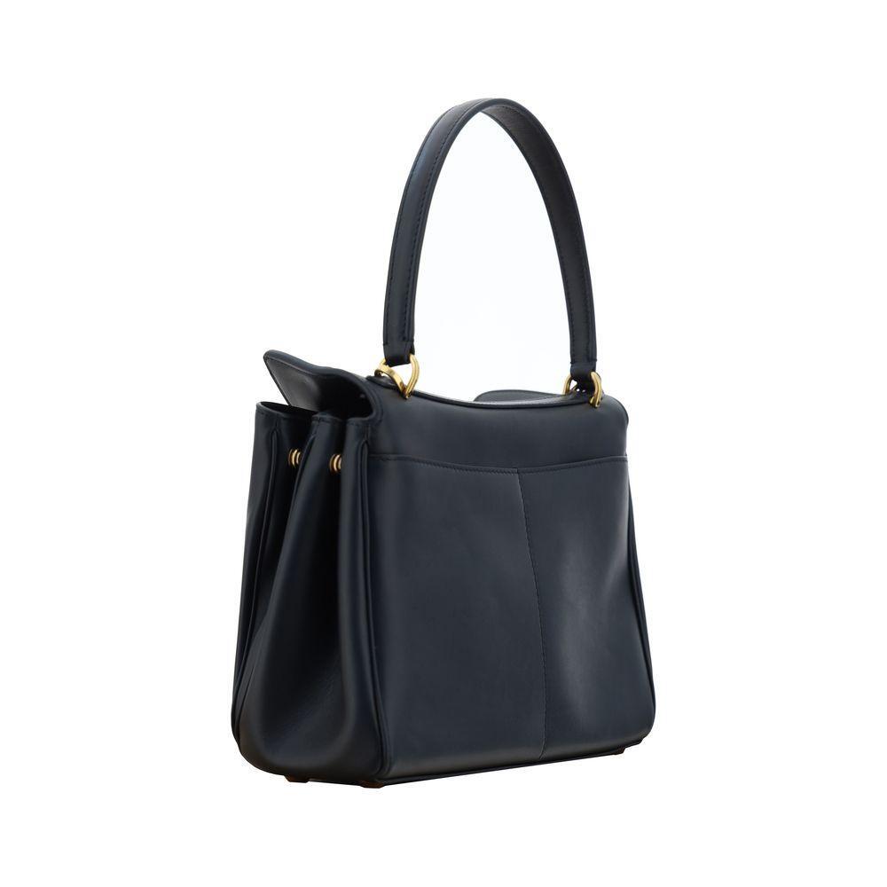 Front view with bag zipped and handles upright.