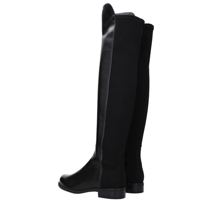 Stuart Weitzman Black Leather Over The Knee boots with a low flat heel, vintage effect, round toe, and rubber sole.