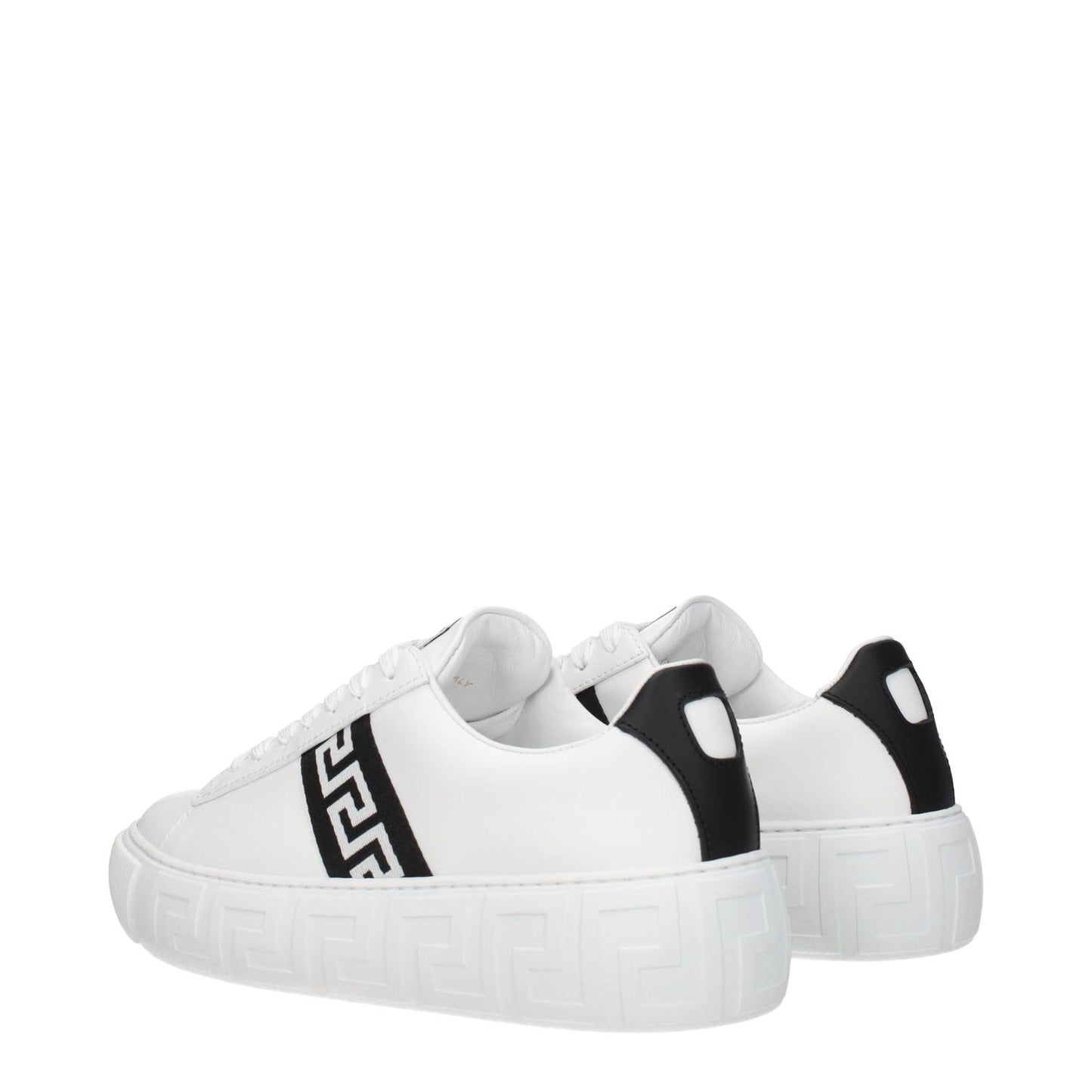 Versace White Leather Low Top Sneakers with black accents, featuring a front logo, lace-up closure, round toe, and rubber sole, side view.
