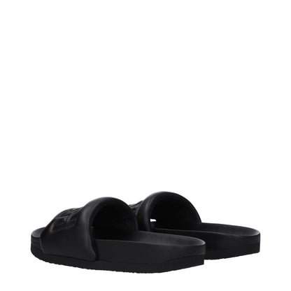 Ambush Black Leather Slippers with front logo, open toe design, and rubber sole in a stylish streetwear style.