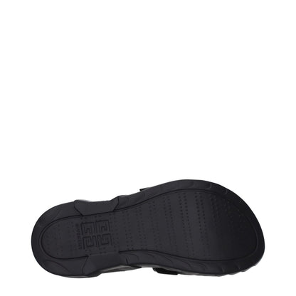 Sole view of Givenchy Black Fabric Slippers with logo and rubber sole, open toe, mid heels, and clips closure.