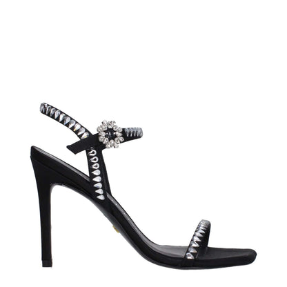 Stuart Weitzman Black Satin Stiletto Heel Sandals with rhinestone details and buckle closure, featuring a sleek high heel design.