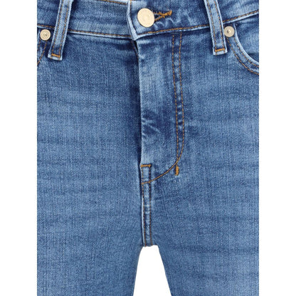 Close-up of 7FOR Blue Cotton Flared Jeans featuring five-pocket design and zip-button closure on Slim Illusion denim.
