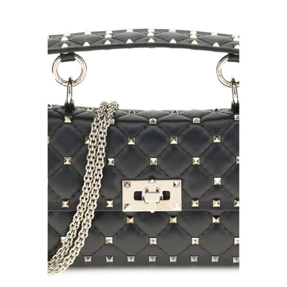 Valentino Garavani Black Calf Leather Bos Taurus Handbag with Rockstud Spike design and studded shoulder strap detail.