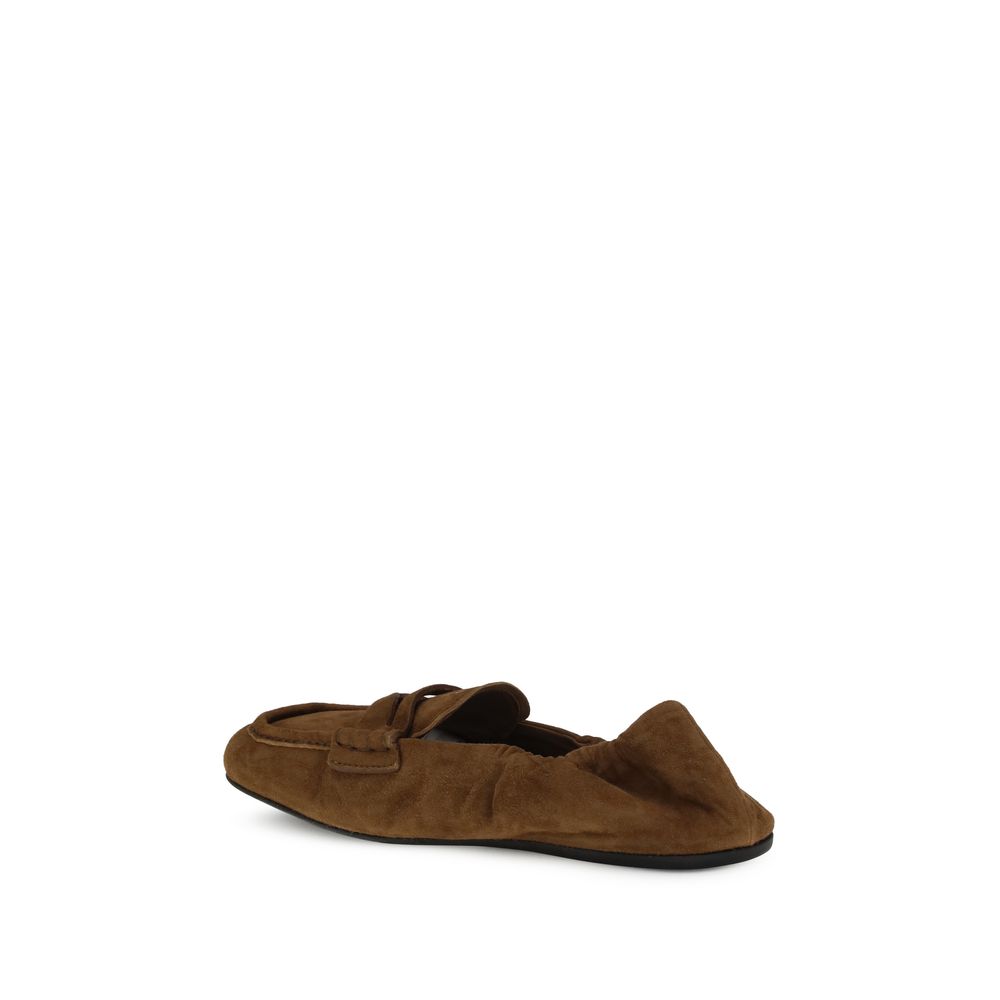 Miu Miu Brown Calf Leather Bos Taurus Slip-On Loafers with horsebit embellishment, suede material, for stylish comfort.