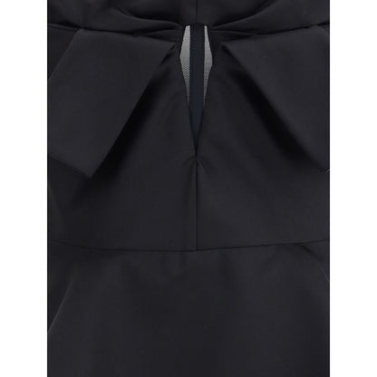 Alexander McQueen Black Polyester Top with bow detail and peplum, elegant sleeveless design, AW25 collection.