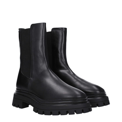 Stuart Weitzman Black Leather Ankle Boots with round toe, mid heels, and rubber sole. Casual style with back logo detailing.