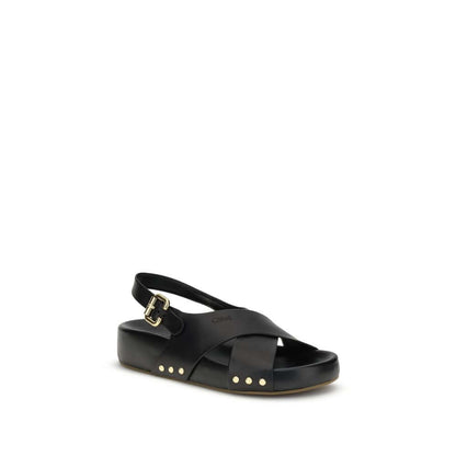 Chloé Mae Sandals with black crossed straps, gold studs, and Paddington buckle for refined elegance.