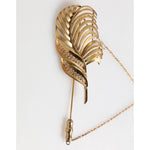 Dolce & Gabbana Gold Tone Leaf 925 Sterling Silver Crystal Chain Brooch showcasing elegant leaf design with crystals and a chain.
