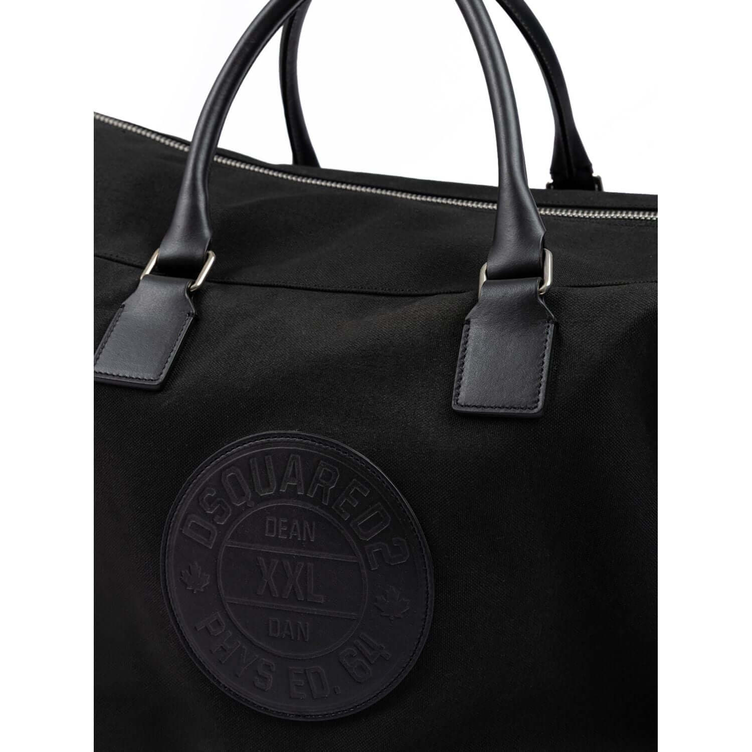 Front view with bag zipped and handles upright.