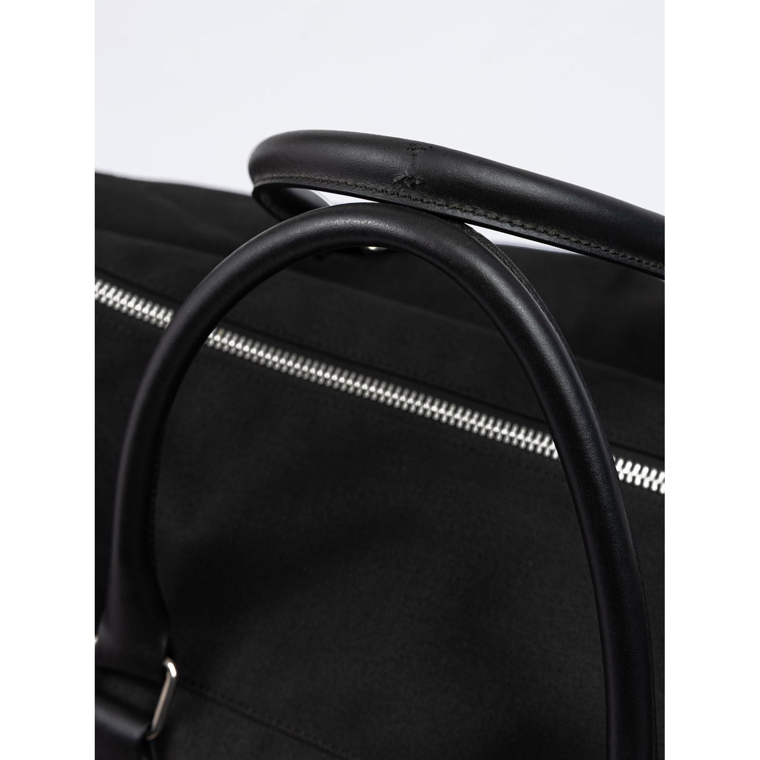 Front view with bag zipped and handles upright.