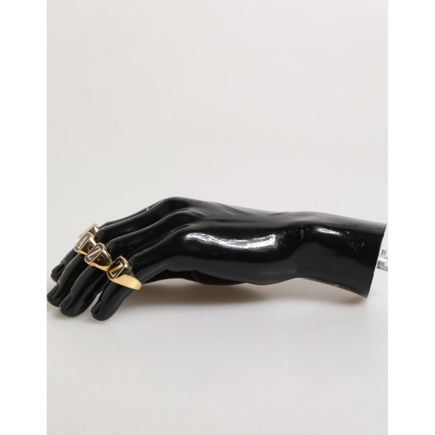 Dolce & Gabbana Gold Tone Brass JAZZ Letter Set 4 Pieces Adjustable Ring on mannequin hand