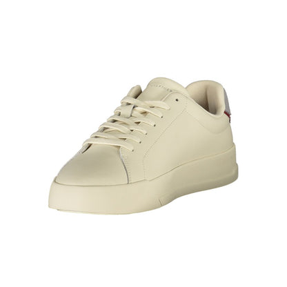 Tommy Hilfiger Beige Leather Men Sneaker with grey accents, featuring a sporty design and signature logo for modern luxury.