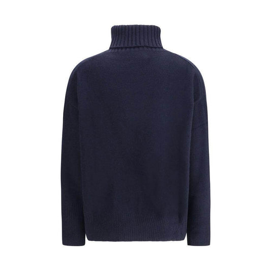 Back view of navy Allude Turtleneck Sweater made from pure cashmere featuring ribbed cuffs and high collar for a cozy, elegant look.