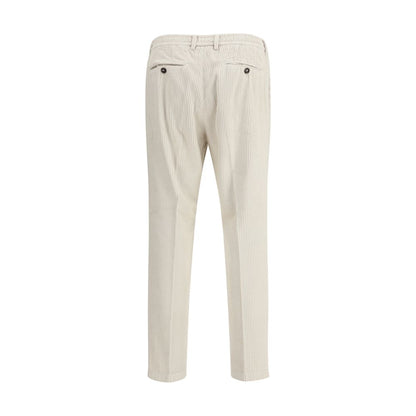 Back view of Cruna White Cotton Casual Pants with belt loops and slim cut, perfect for a refined look in the cooler season.