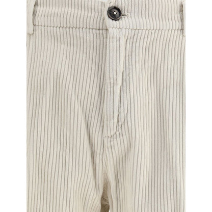 Close-up of Cruna White Cotton Casual Pants featuring corduroy texture, zip-and-button closure, and slim fit design for autumn-winter fashion.