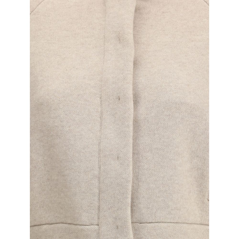 Brunello Cucinelli Beige Cashmere Clothing with button and zipper closure detail, showcasing luxurious texture and contemporary style.
