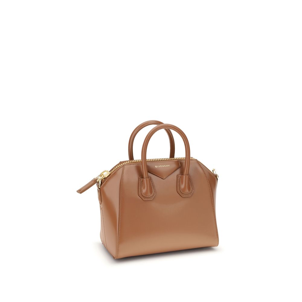 Givenchy Brown Calf Leather Bos Taurus Handbag with geometric design and monogram, featuring zipper closure and adjustable strap.