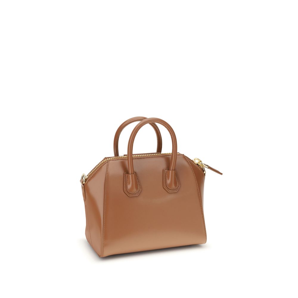 Givenchy Brown Calf Leather Bos Taurus Handbag with geometric design, top handles, and adjustable strap for versatile style.