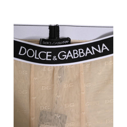 Close-up of Dolce & Gabbana Beige Nylon Logo Lace Leggings Pants Underwear with DG logo waistband in beige lace.