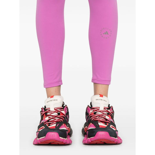 Adidas By Stella McCartney Trousers Purple with logo print, fuchsia pink waistband, Balenciaga sneakers, 7/8 length.