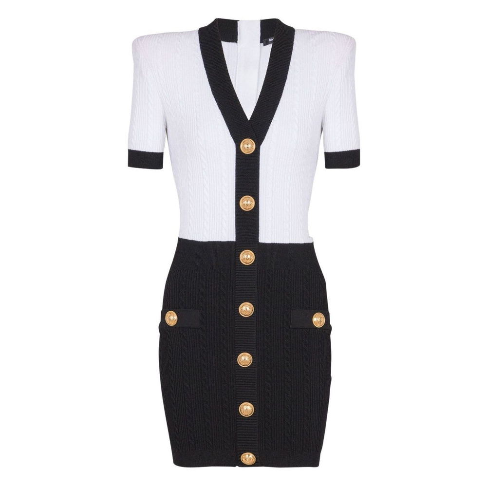 Balmain Two-tone twisted knit bodycon dress with gold buttons, white and black V-neck short sleeve mini dress front view.