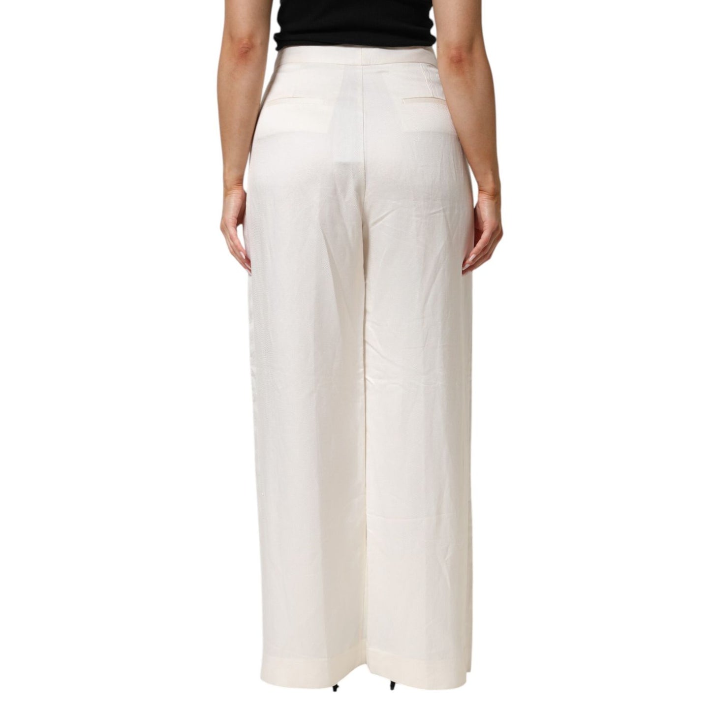 Back view of Brian Dales White Viscose Linen Wide Leg Palazzo Womens Pants on person showcasing relaxed fit and high-waist design.