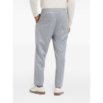 Back view of Brunello Cucinelli Drawstring trousers in beluga grey virgin wool with tapered leg, elasticated waistband, and jetted pockets.