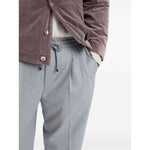 Brunello Cucinelli Drawstring trousers in beluga grey virgin wool with elasticated waistband and tapered leg design.