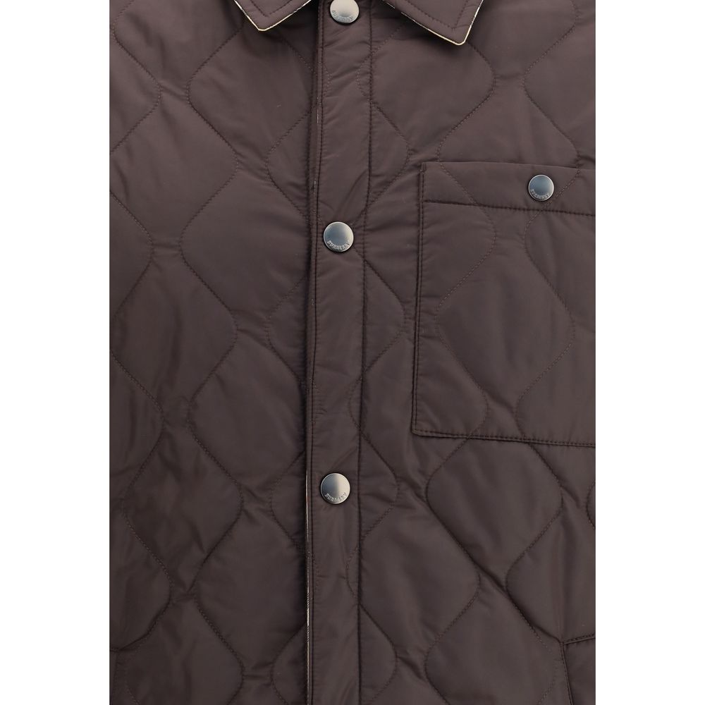 Close-up of Burberry Brown Polyamide Coat featuring quilted nylon design, snap buttons, a chest pocket, and stylish collar detailing.