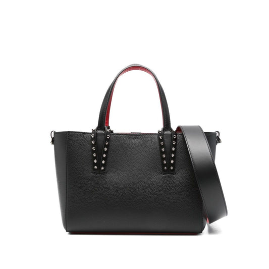 Christian Louboutin Cabata mini leather tote bag with black spiked studs, flat top handles, and detachable shoulder strap.