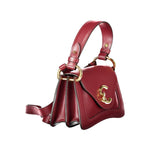 Coccinelle red leather handbag with gold accents and adjustable strap