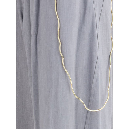 Close-up of Darkpark Gray Polyester Casual Pants with gold chain detail and front pleats, showcasing elegant design for AW25 season.