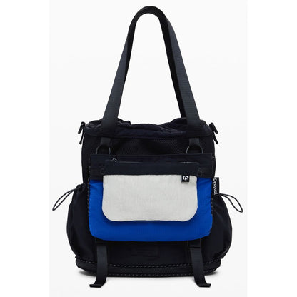 Desigual Black Polyester Women Handbag with blue and white front pouch, sleek design, and adjustable straps for versatile use as handbag or backpack.