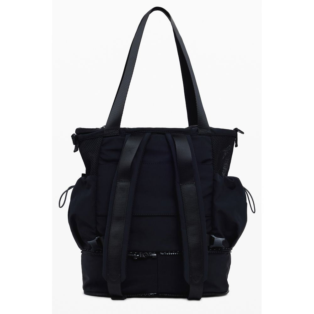 Desigual Black Polyester Women Handbag with adjustable straps and pockets, showing versatile design and functionality.