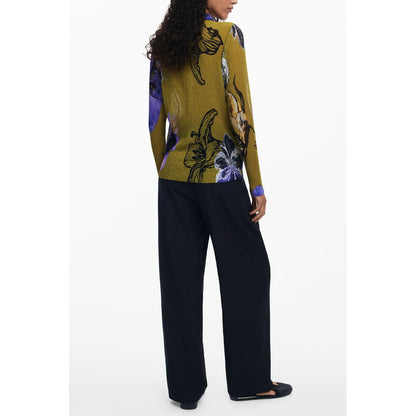 Woman wearing Desigual Green Polyester Women Shirt with floral design, paired with black pants, showcasing a stylish back view.