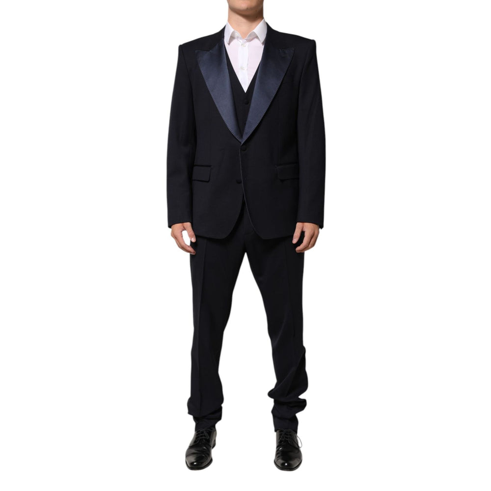 Man wearing Dolce & Gabbana Black 3 Piece Wool Silk Blend Suit SICILIA with satin peak lapels.