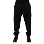 Dolce & Gabbana Black Polyester Logo Plaque Sweatpants Jogger Pants with drawstring closure and side pockets for stylish casual wear.