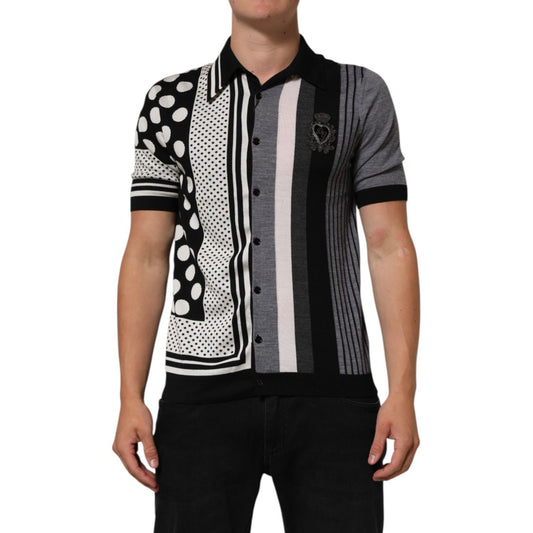 Man wearing Dolce & Gabbana Black White Polka Dot Collared Polo T-shirt with striped detail, front view.