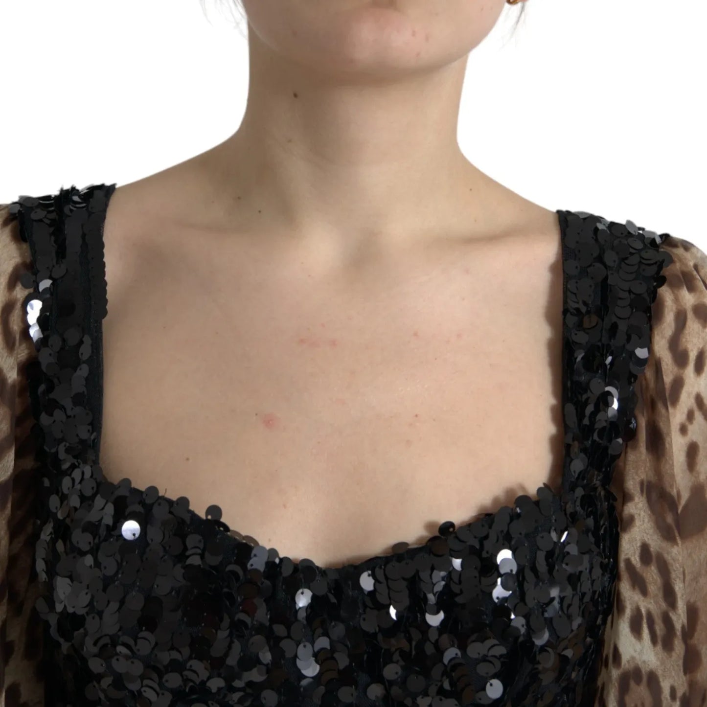 Close-up of Dolce & Gabbana Leopard Print Silk Sequin Ruffle Maxi Dress showcasing the sequined bodice and leopard print sleeves.