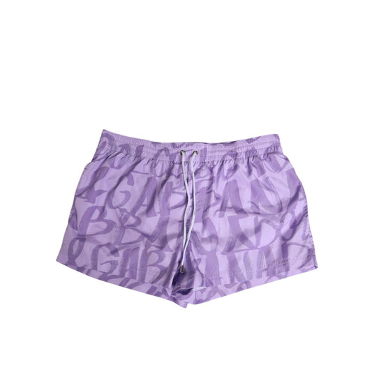 Dolce & Gabbana Purple DG Logo Print Nylon Men Shorts Swimwear with drawstring waist featuring lavender logo design.