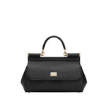 Dolce & Gabbana Sicily Medium Handbag in black with foldover top, push-lock fastening, and detachable shoulder strap.