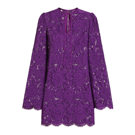 Dolce & Gabbana bell sleeves Lace mini dress in amethyst purple with rear zip and front tie fastening.